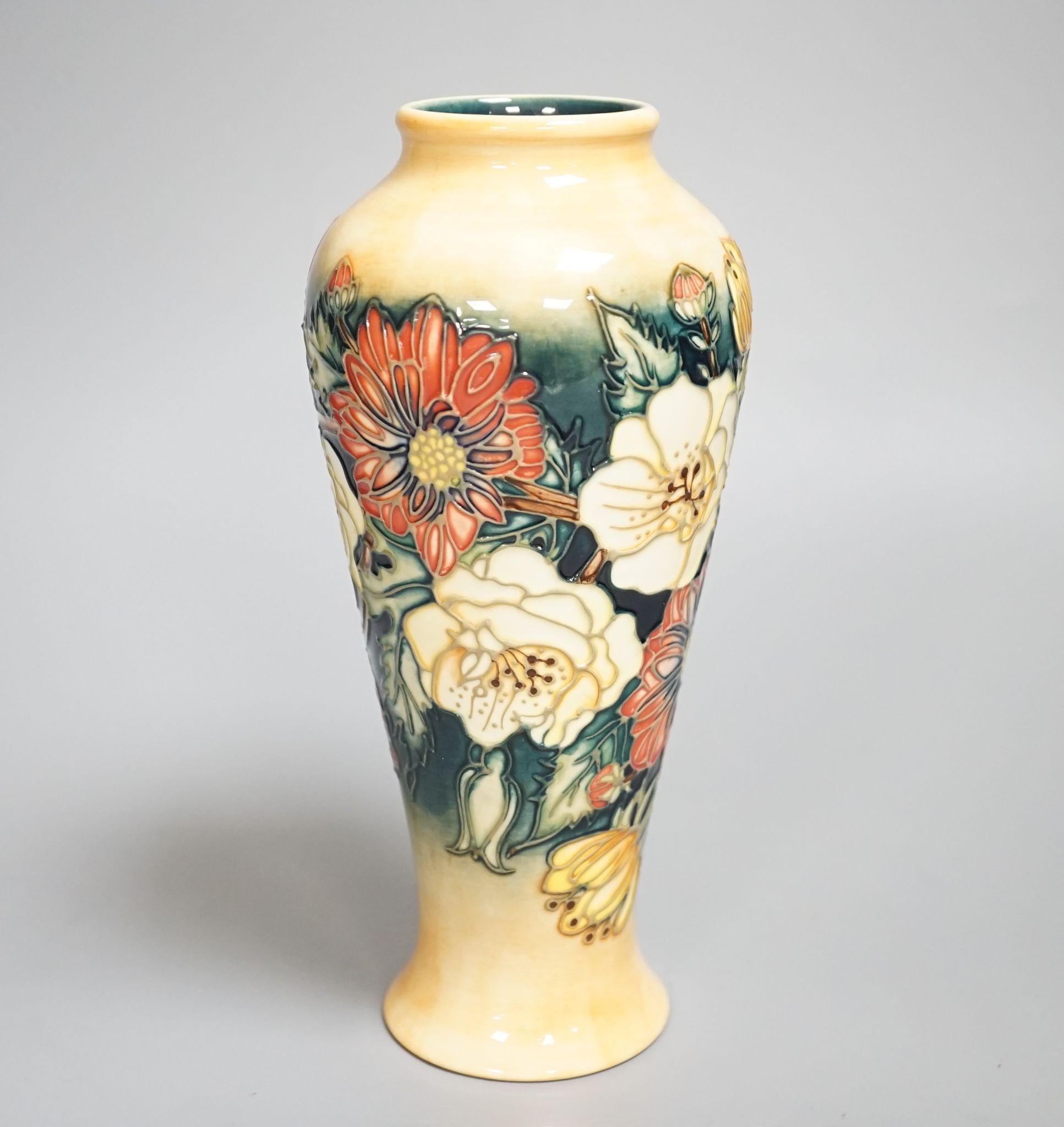 A Moorcroft vase, multi floral designed, signed E Bossons, 20.5 cms high.